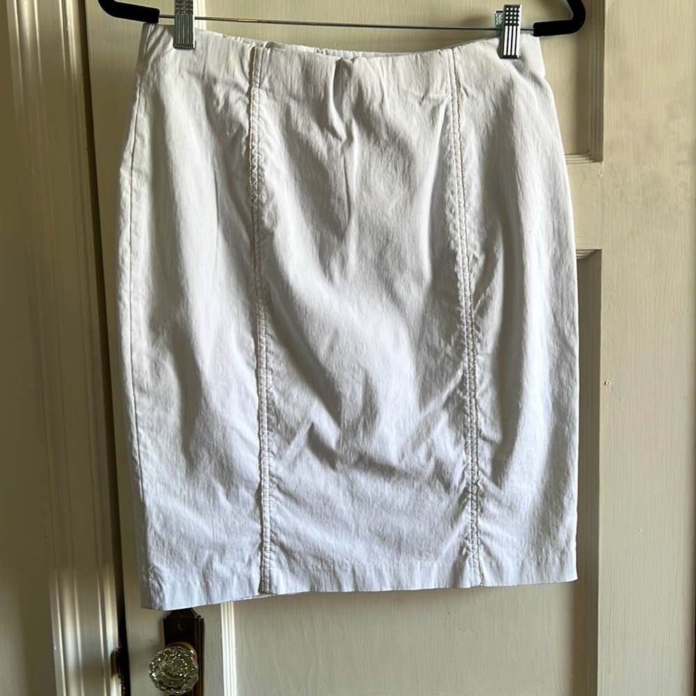 Never worn. White pencil skirt with mini-beaded accents.